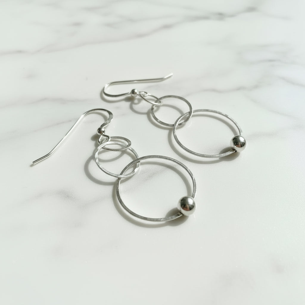 Silver dangling circle earrings