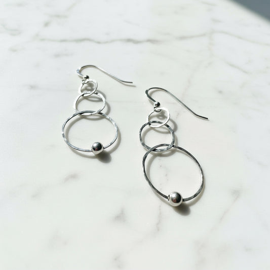 Silver hoop earrings with circles