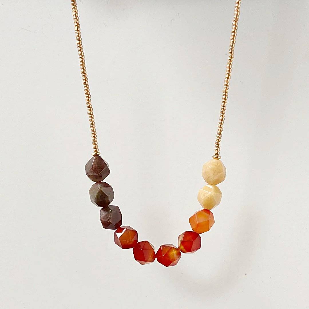 Uni-T Design Beaded Carnelian Necklace with symmetrical gemstone arrangement and gold seed bead chain, perfect for everyday wear or gifting.