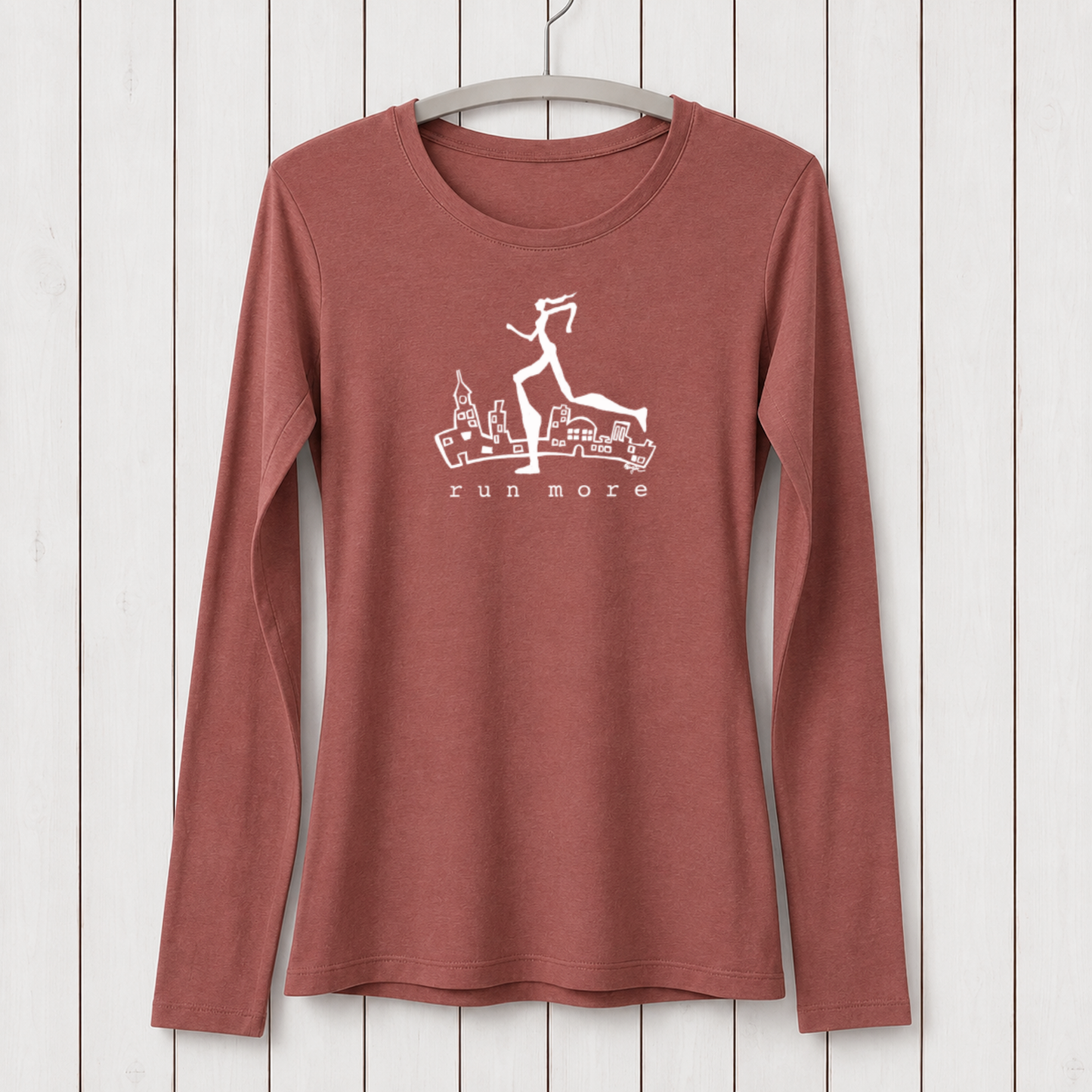 Rust-colored women's long sleeve T-shirt made from bamboo organic cotton with a graphic of a running woman over cityscape, perfect for active lifestyles.