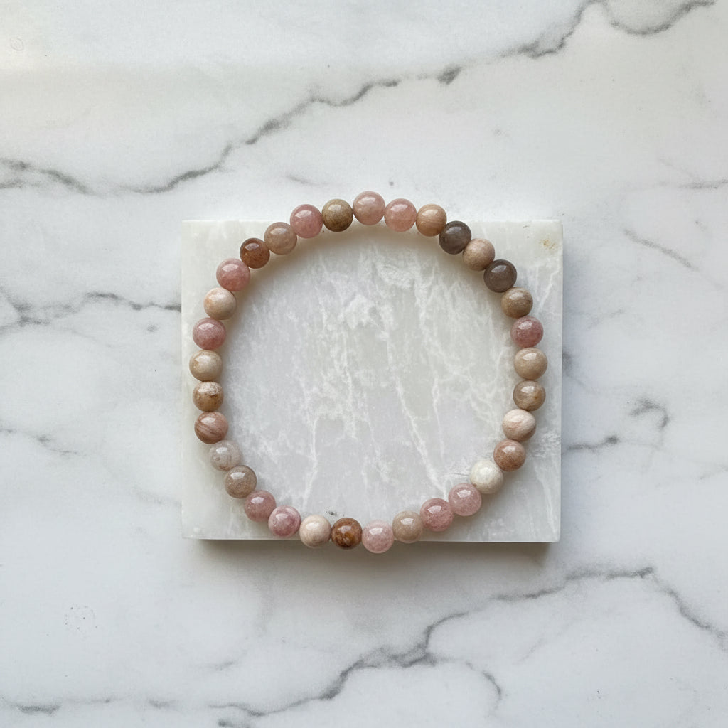 Beaded gemstone bracelet on white marble slab