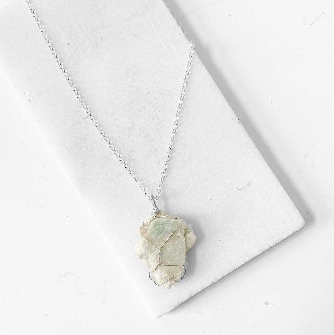 Elegant Amazonite gemstone necklace with sterling silver chain, perfect for adding a touch of nature-inspired charm and positivity to any outfit.