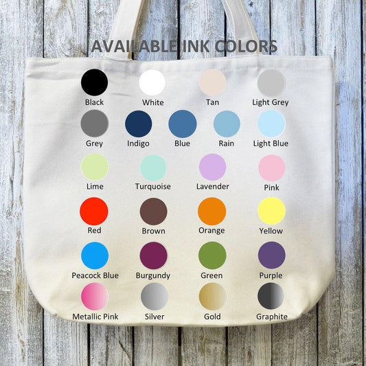 Organic canvas tote bag shown with 26 available ink colors for customization. Perfect for culinary enthusiasts seeking a sustainable, personalized bag.