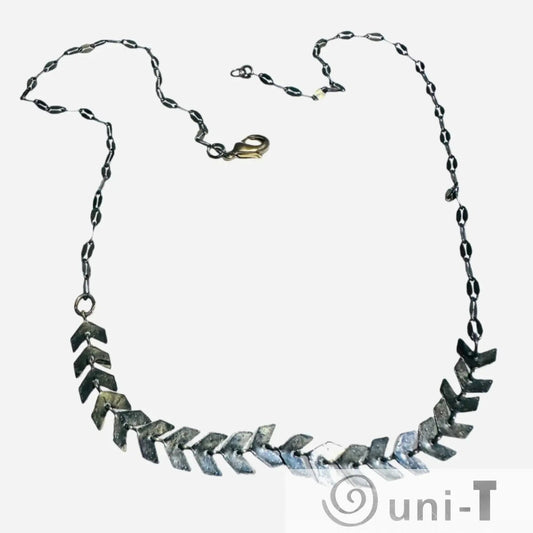 Chevron Brass Necklace - Antique Brass Chain | 16-Inch Length, showcasing chevron-shaped brass elements on a dark patina chain.