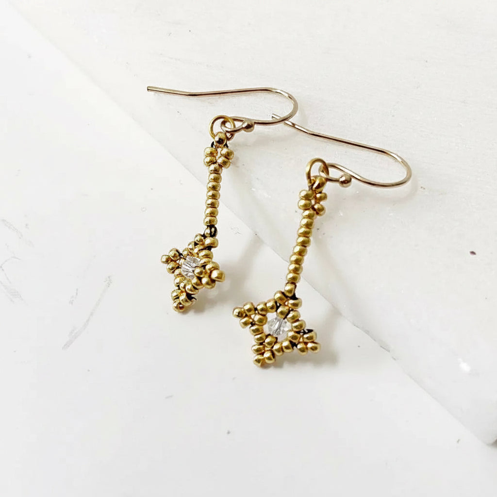 Elegant Crystal Woven Earrings with gold seed beads and clear crystal accents. Perfect handmade jewelry for gifting or accessorizing.