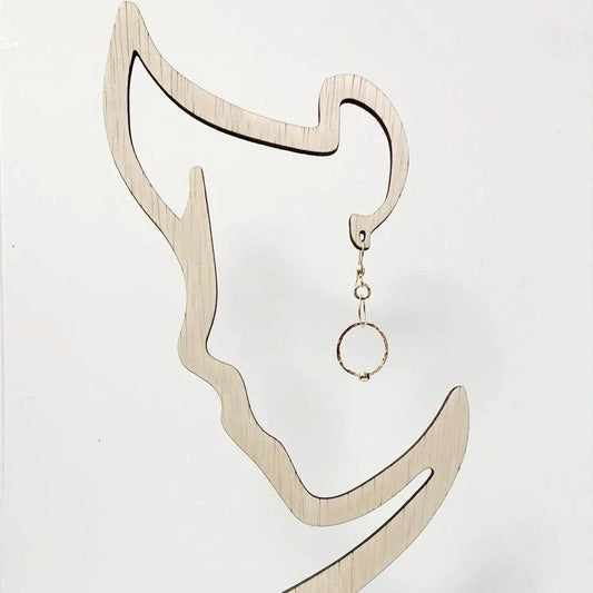 Gold HoopLink Earring displayed on a wooden silhouette stand, showcasing its elegant circular design and soldered link construction.