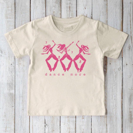 Eco-friendly kids' cream t-shirt with pink 'dance more' graphic, organic cotton tee promoting playful movement and sustainable fashion.