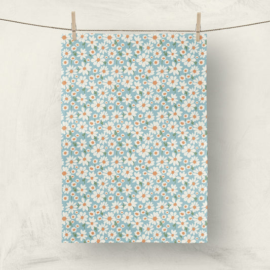Daisy print fabric tea towel hanging on clothesline for home decor