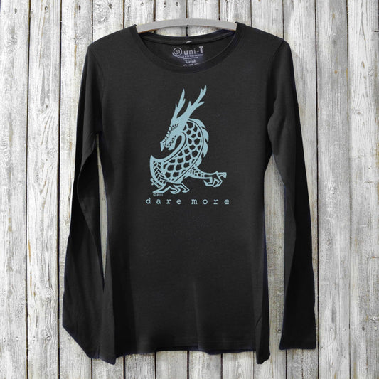 Black bamboo and organic cotton women's long sleeve T-shirt featuring a light blue dragon and 'Dare More' text. Eco-friendly adventure gift top.
