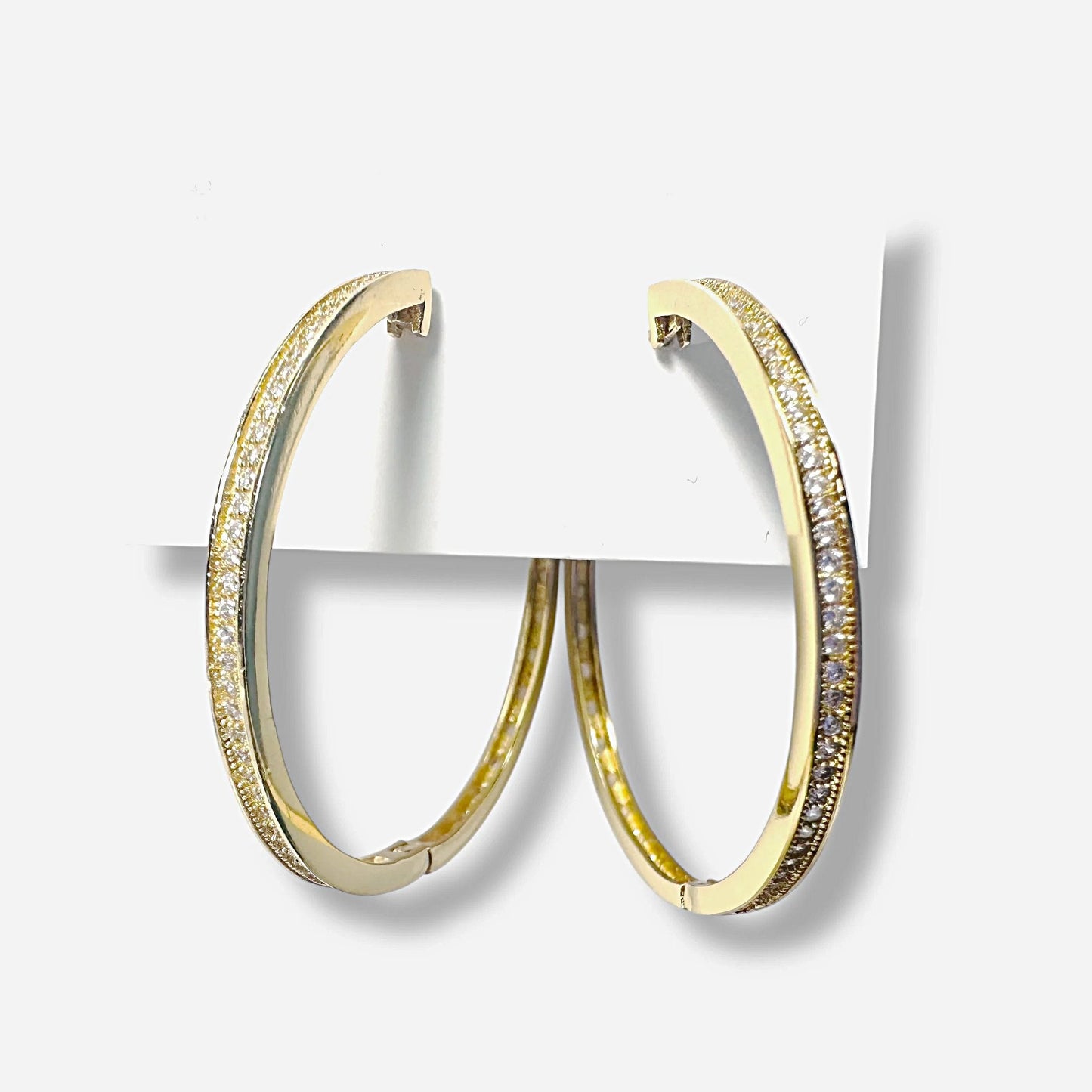 Close-up of Gold Filled CZ Encrusted Hoop Earrings