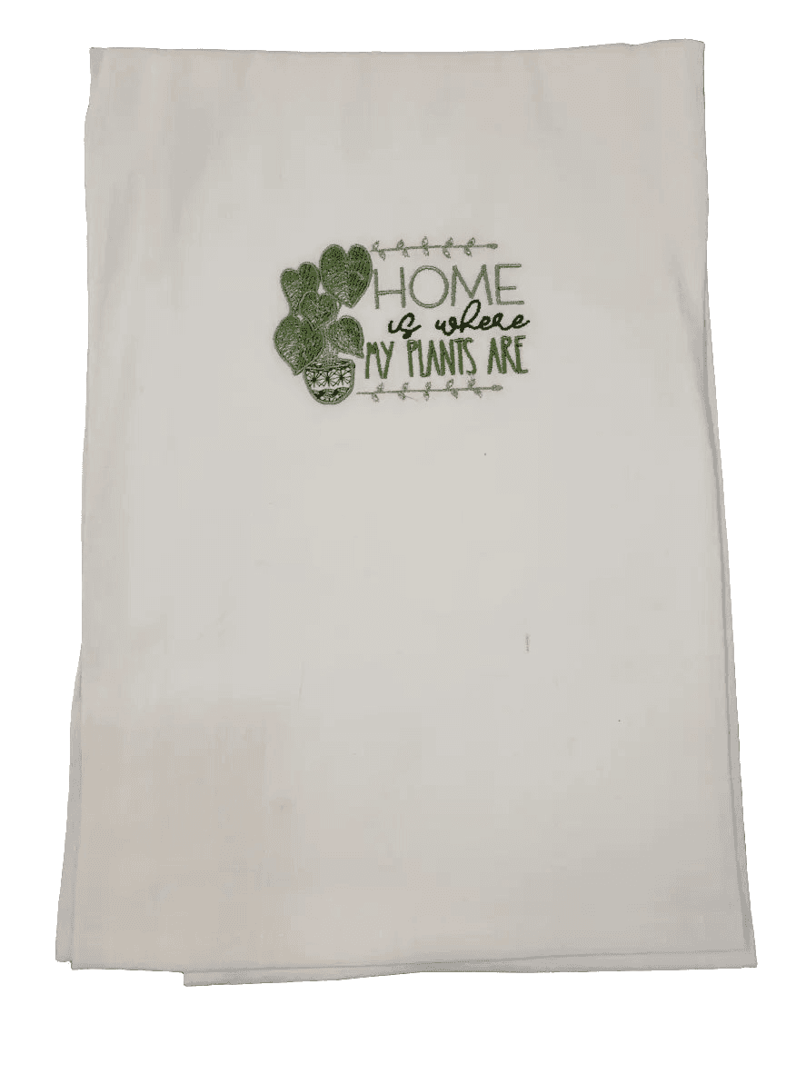Folded embroidered plant towel with heart-shaped leaves and home quote. Perfect small gift for gardening fans and kitchen decor accents.