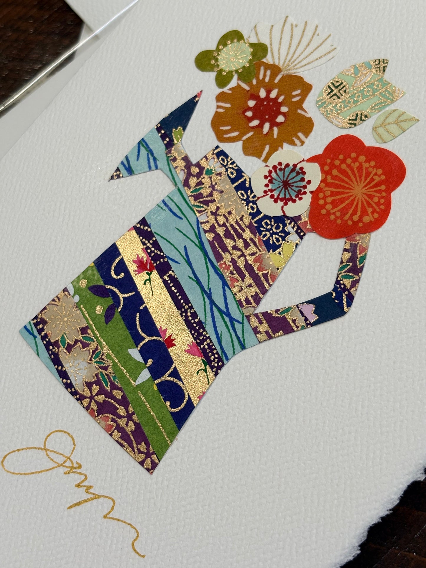 Handmade collage greeting card with floral design and colorful paper cutouts