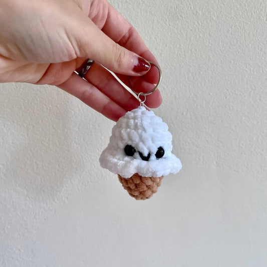 White chenille yarn Ice Cream Cone Keychain with cute facial features and keyring. Soft, handmade small gift perfect for bags or backpacks.