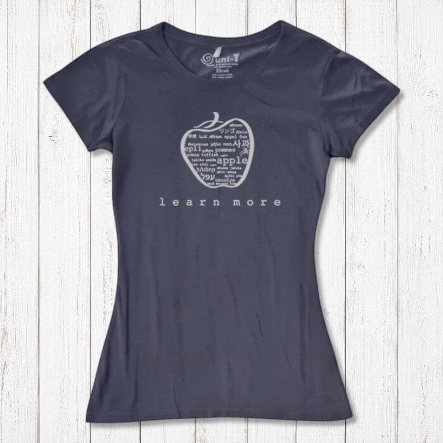 Navy blue women's apple T-shirt in bamboo & organic cotton with 'learn more' graphic, inspirational and sustainable teacher gift.