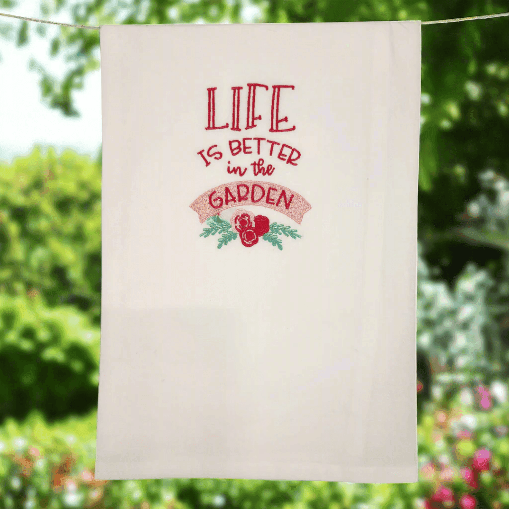 Life is Better in the Garden embroidered towel hanging outdoors, perfect for garden lovers and kitchen décor in the Home & Garden category.
