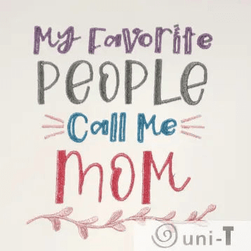 Close-up of embroidered text 'My favorite people call me Mom' in colorful thread. Sentimental kitchen towel gift for moms and home decor lovers.