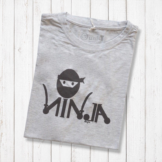 Men's Ninja T-Shirt in Bamboo & Organic Cotton folded on white wood, featuring black 'Stealth Mode' ninja graphic in classic fit.