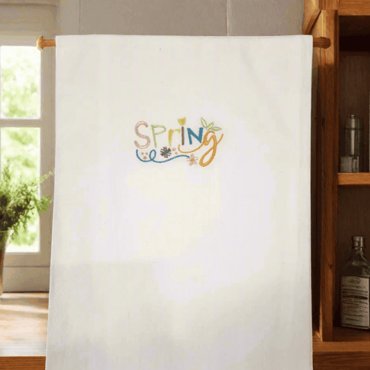 Spring Embroidered Towel - Embroidered Kitchen Towel | Durable, hanging in a cozy kitchen setting, perfect for adding a cheerful spring touch.