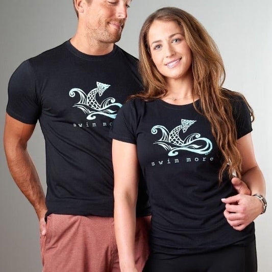 Couple wearing black 'Swim More' graphic tees made from bamboo and organic cotton. Stylish fitness and beach gift for swimmers by Uni-T.