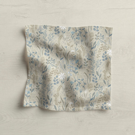 Floral patterned fabric napkin on light wood surface