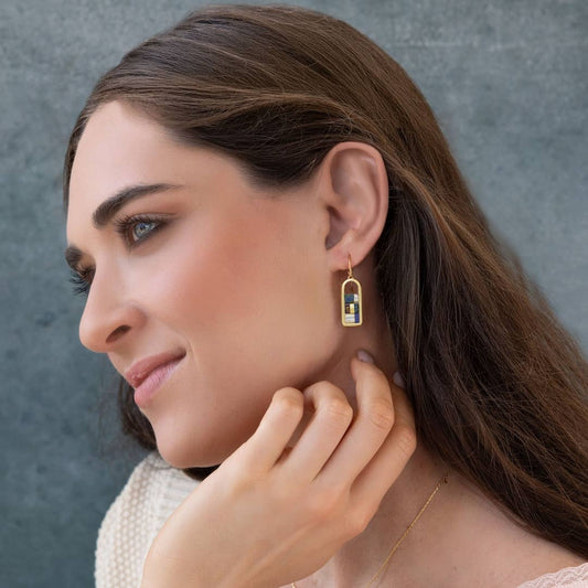 Model wearing Miyuki Frame Earrings - Indigo/Gold, showcasing the elegant blend of indigo and gold tones for a chic, contemporary look.