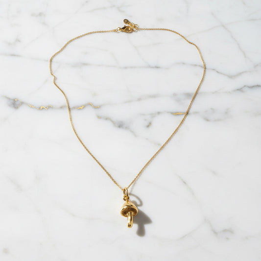 Close-up of Dainty Golden Mushroom Necklace* pendant