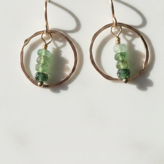 Dainty Emerald Earrings featuring textured metal hoops and green gemstone beads
