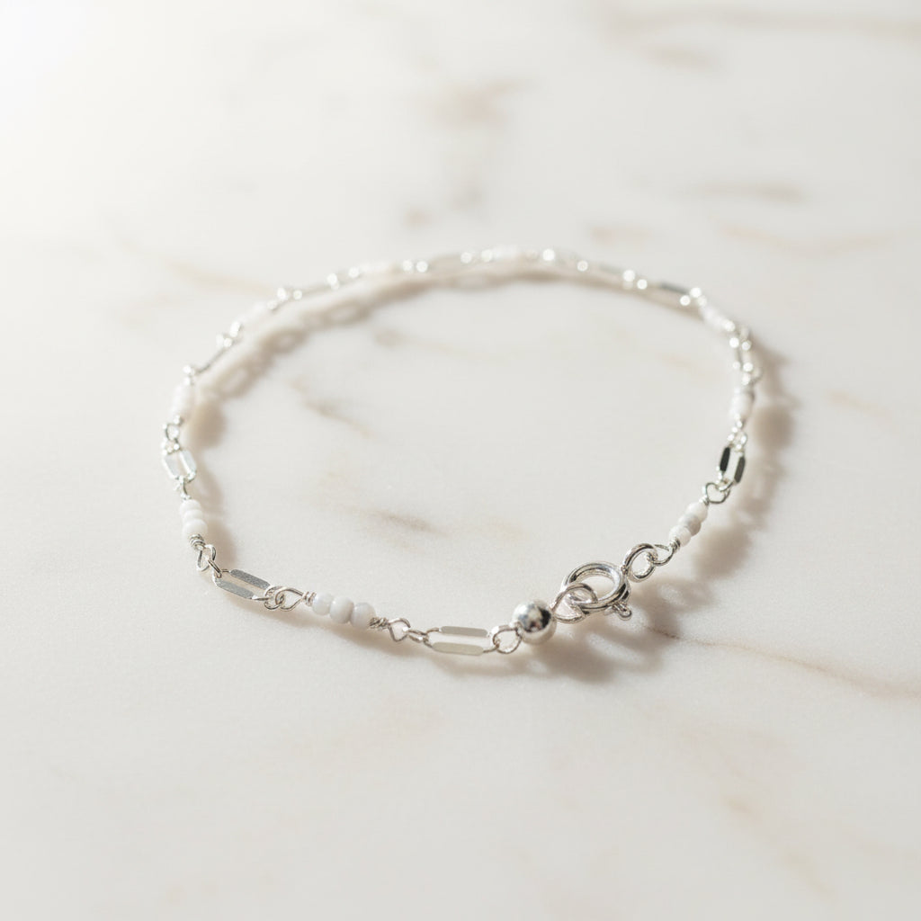Elegant white beaded bracelet with silver clasp