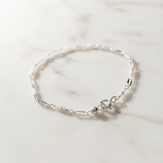 Elegant white beaded bracelet with silver clasp