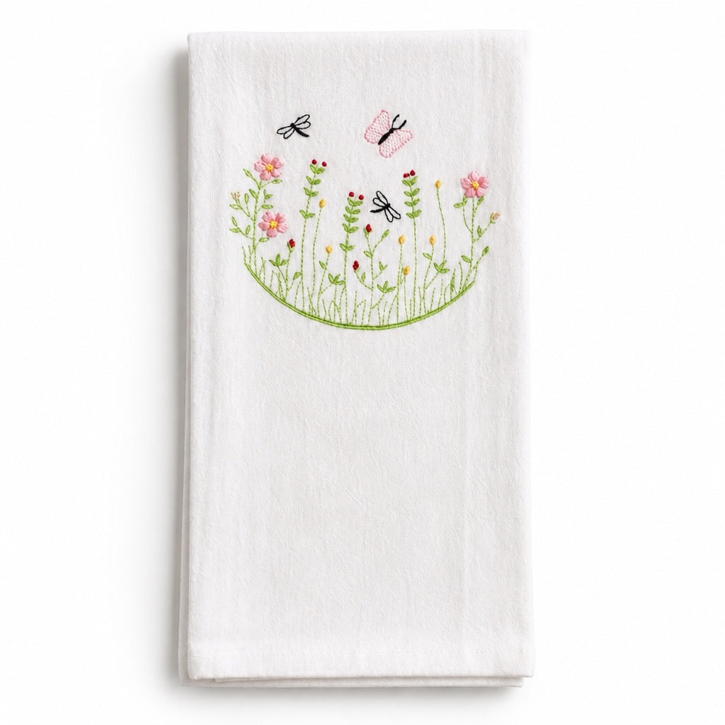Uni-T white flour sack kitchen towel featuring delicate embroidery of pink flowers, butterflies, and dragonflies.