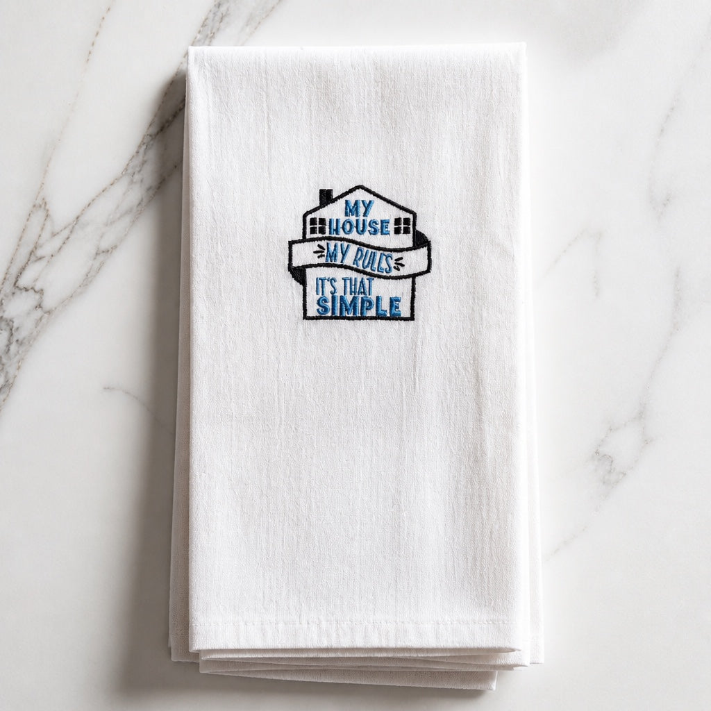 Uni-T white kitchen towel featuring blue and black embroidered house design with the text My house, my rules