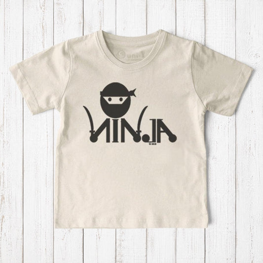 Uni-T kids organic cotton t-shirt in cream featuring a black ninja graphic for active play and martial arts