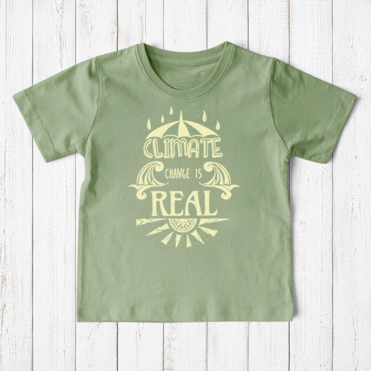 Uni-T sage green organic cotton kids t-shirt featuring a Climate Change Is Real graphic print on a wooden background.
