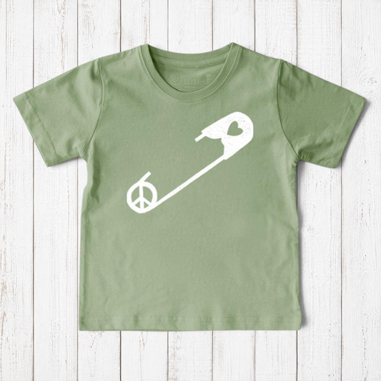 Uni-T sage green organic cotton kids t-shirt featuring a white safety pin graphic with a peace sign symbol