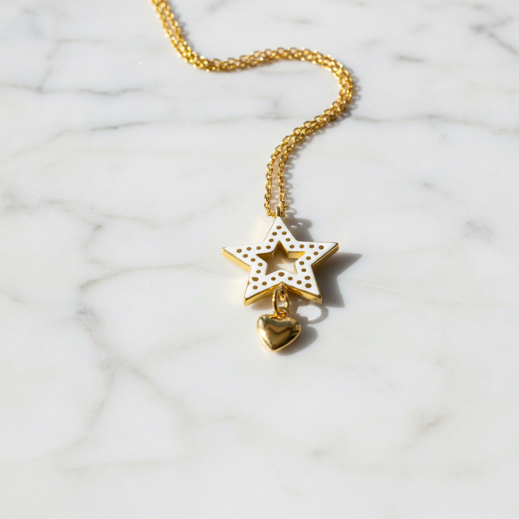 Back view of Cubic Zirconia Star Necklace showing gold star pendant with heart charm, highlighting detailed craftsmanship and polished finish.