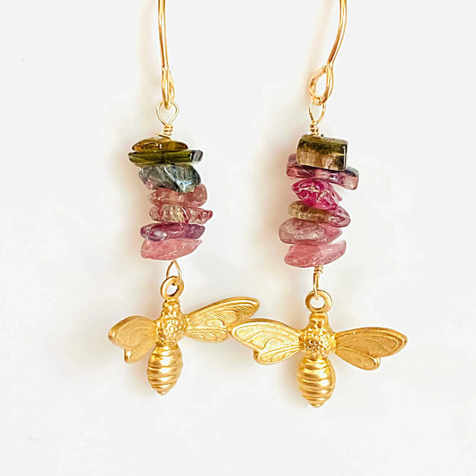 Golden Bee Earrings featuring authentic tourmaline gemstone chips in pink and green hues. Unique handcrafted accessory for jewelry lovers.