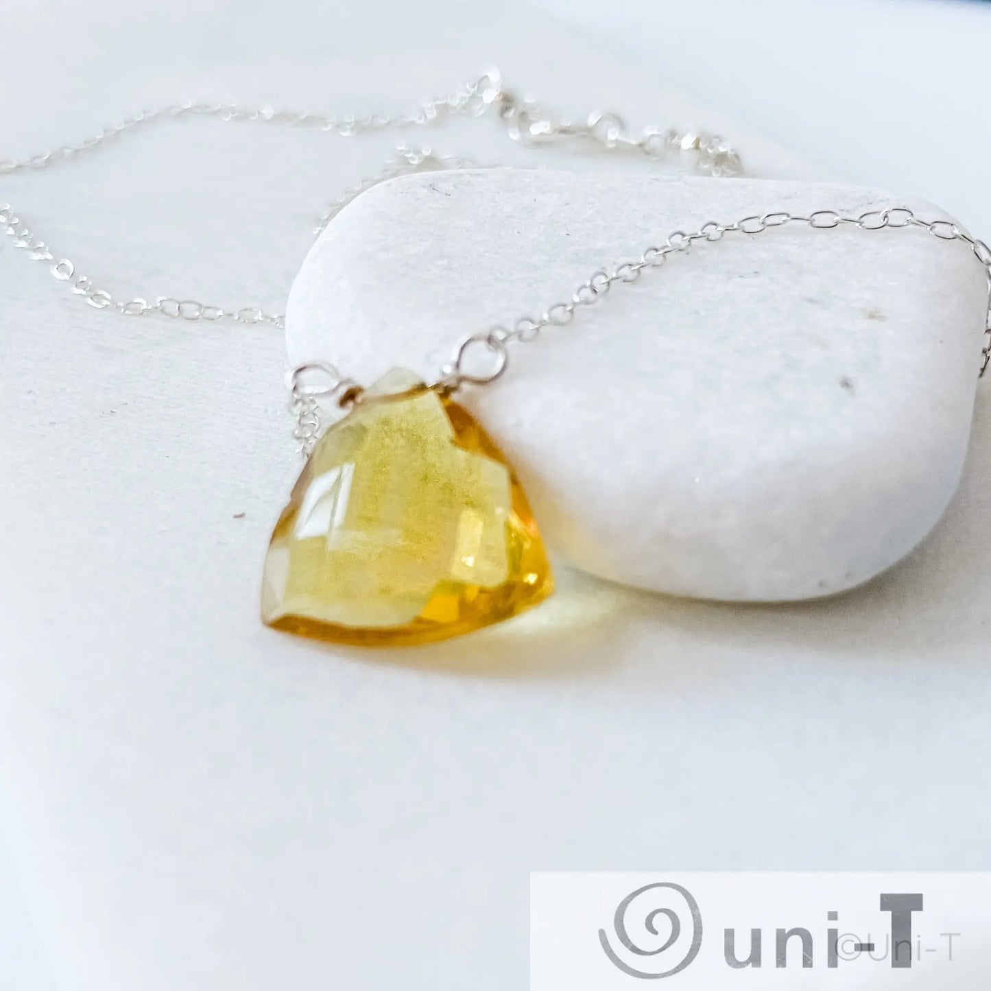 Angled view of Citrine Gemstone Necklace with genuine citrine pendant on fine silver chain, ideal for meaningful jewelry gifts.