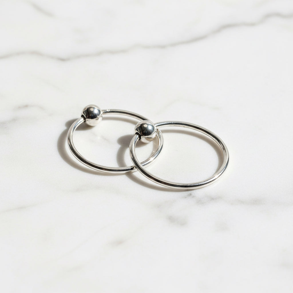Silver Hoop Earrings 12MM - Perfect Everyday Wear, featuring a sleek polished finish with secure ball closure. Ideal for casual or formal outfits.