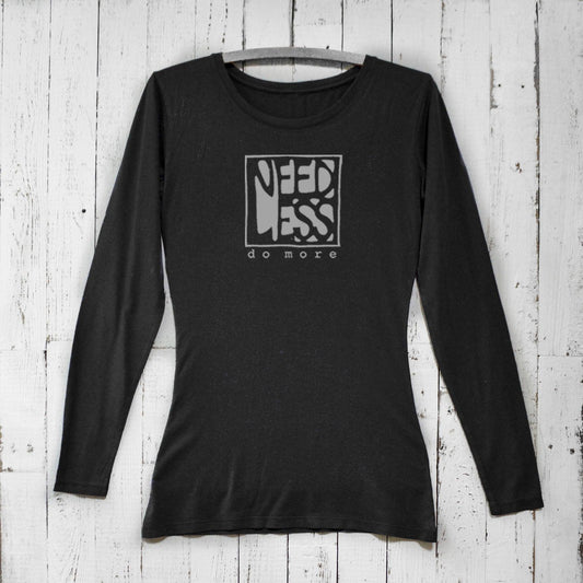 Black women's bamboo and organic cotton long sleeve T-shirt featuring 'Need Less Do More' graphic. Sustainable minimalist gift by Uni-T.