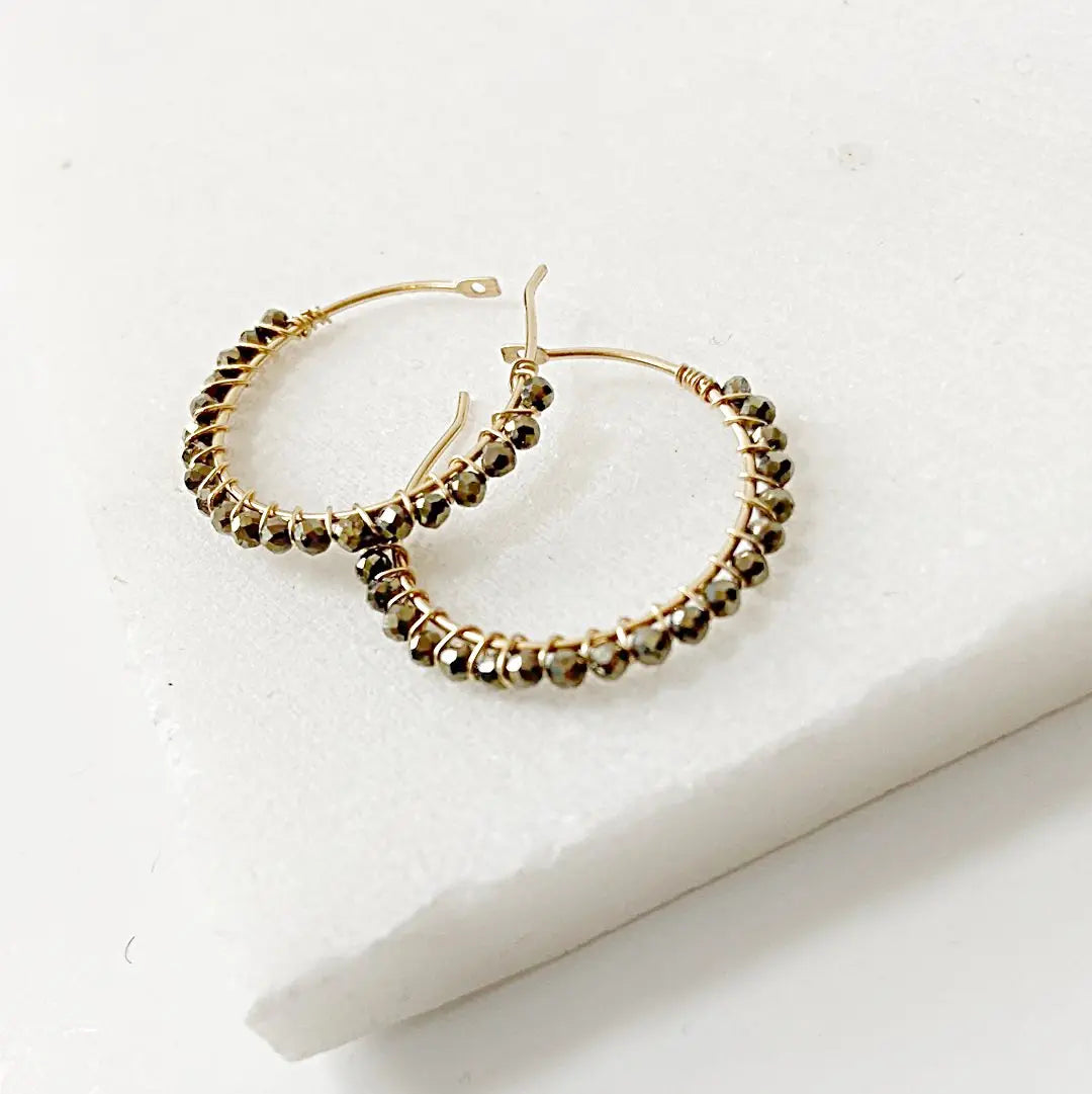 Handmade gemstone hoop earrings in gold fill with shimmering pyrite beads, perfect for gifting or enhancing any jewelry wardrobe.