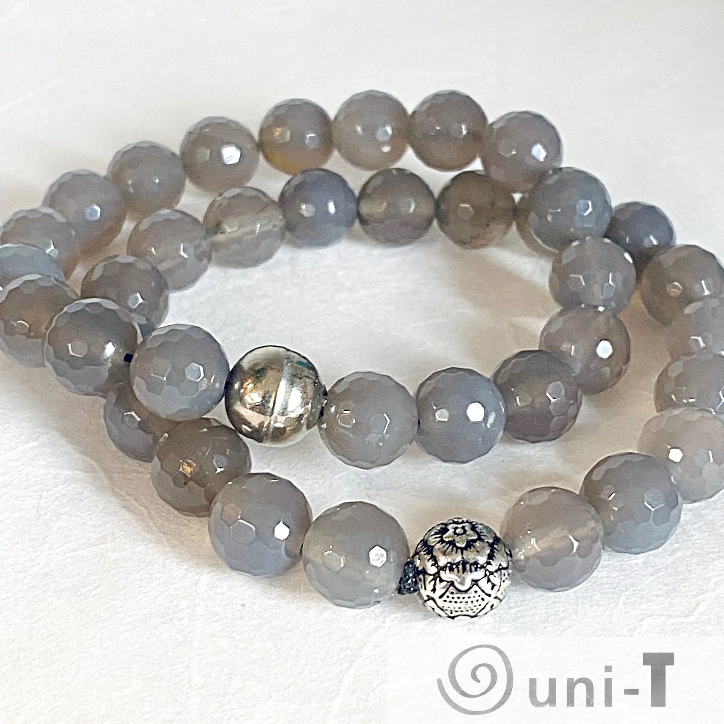 Double-layered Agate Gemstone Stretch Bracelet with faceted grey beads and silver accents. Fashionable and flexible fit for most wrists.