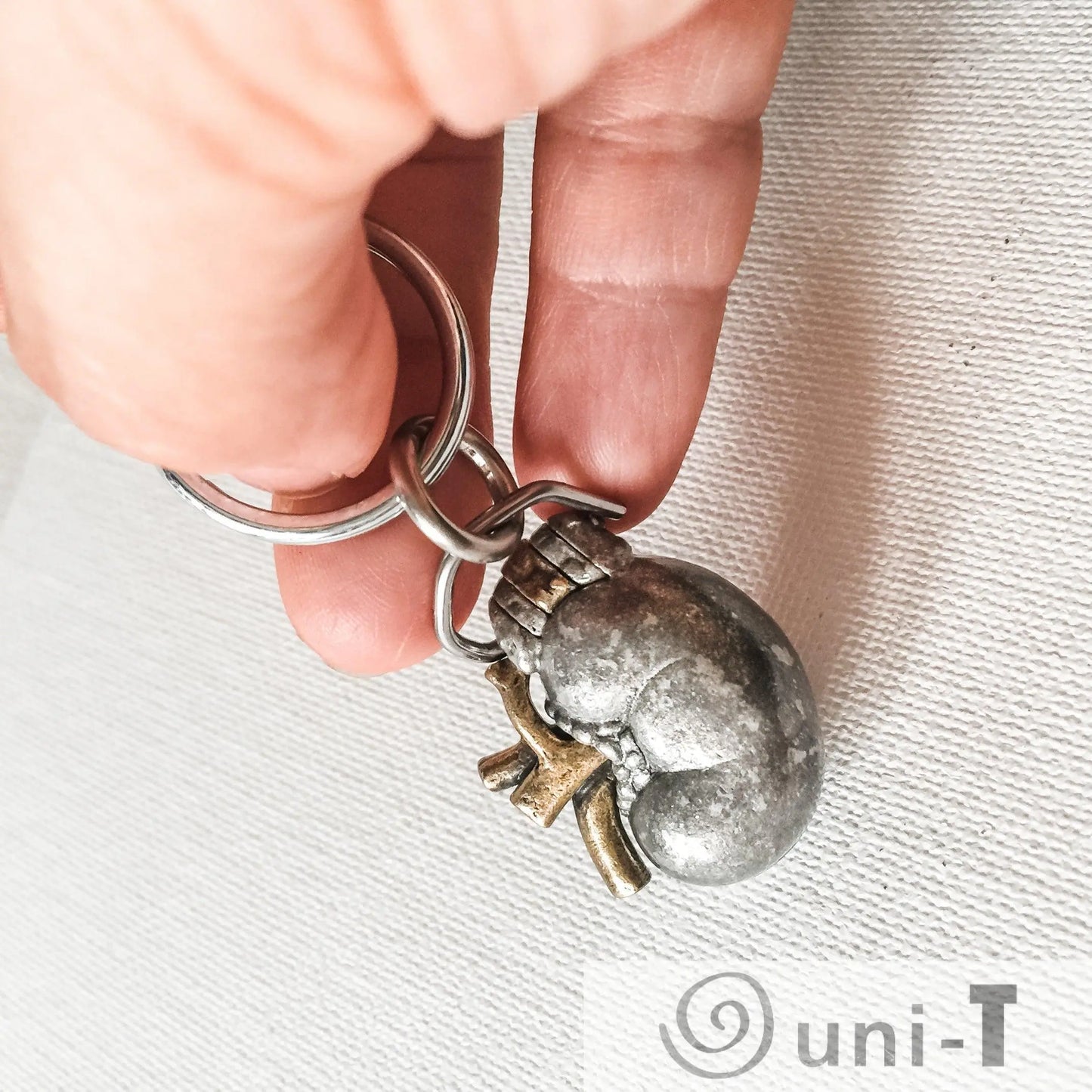 Close-up of Human Kidney Keychain - Anatomy Gift | Genuine Pewter held in hand, showcasing its realistic anatomical detail and durable metal craftsmanship.