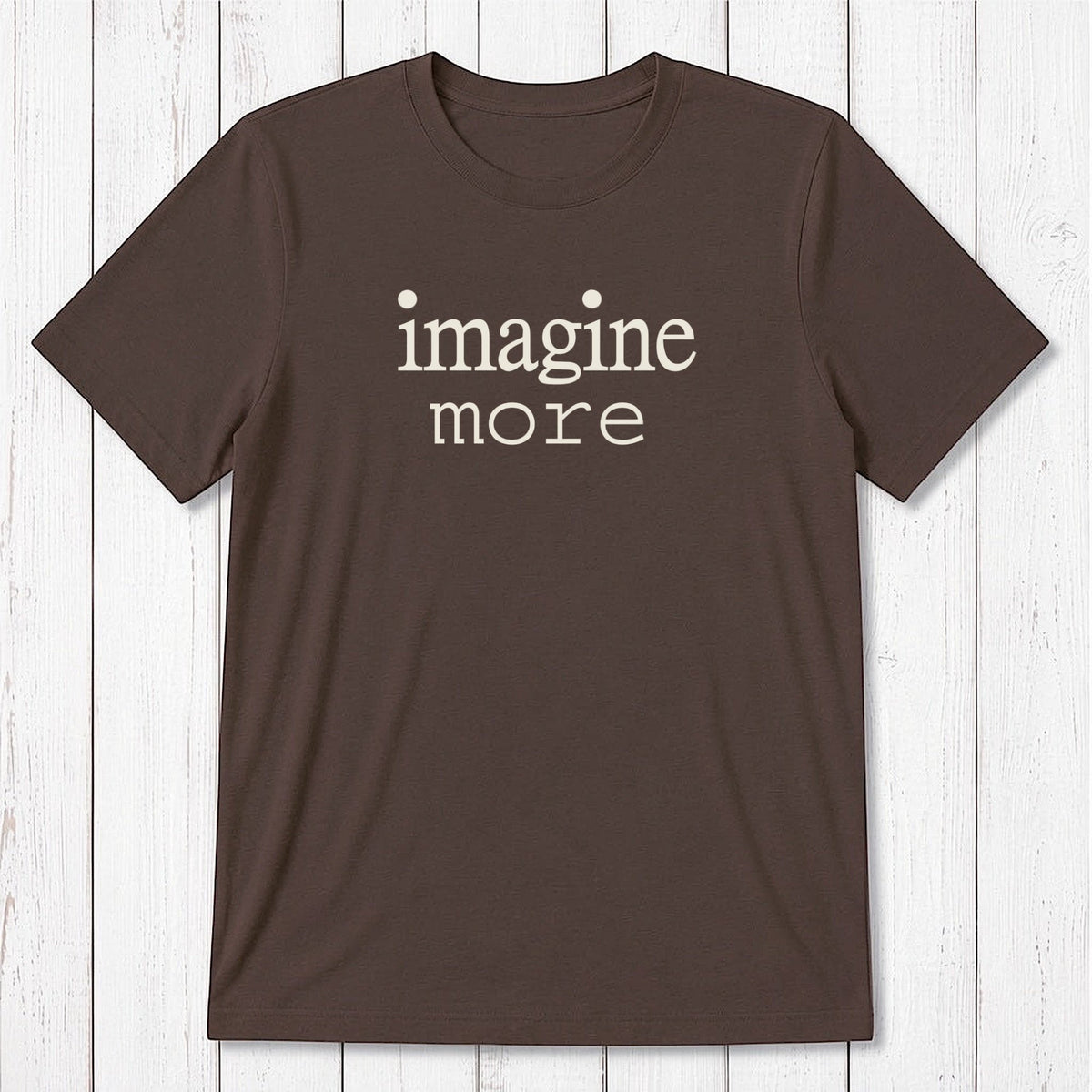 Dark brown Men's Imagine T-Shirt featuring white 'imagine more' text, made from bamboo and organic cotton. Earth-toned tee for creatives.