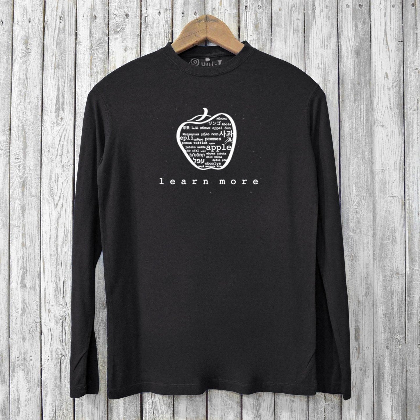 Black Men's Bamboo Long Sleeve T-Shirt with 'learn more' apple graphic. Sustainable, soft, and ideal for teachers and learning advocates.