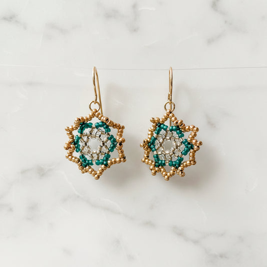 Sterling Silver Green Medallion Earrings featuring intricate floral beadwork in forest tones, perfect for elegant and artistic styling.