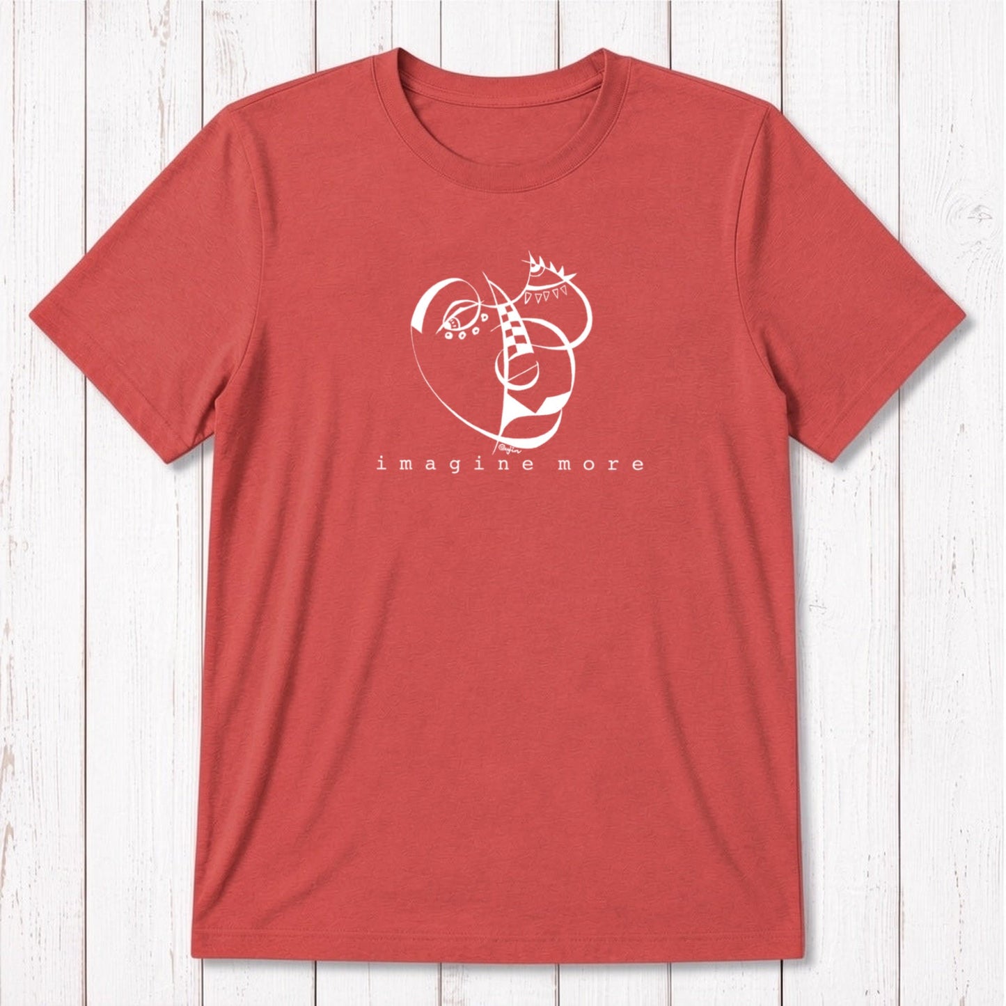 Coral red men's bamboo and organic cotton t-shirt with cream 'Imagine More' graphic. Artistic and sustainable fashion for men.