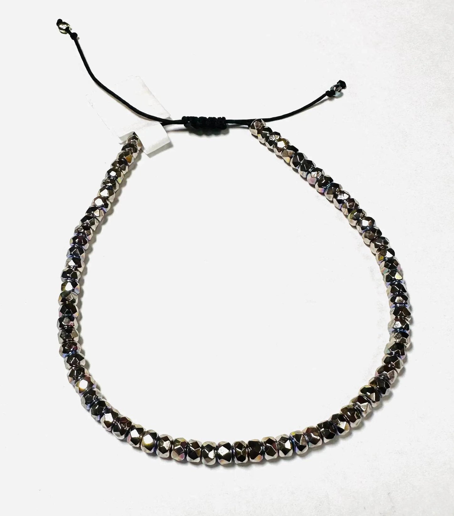 Duplicate image of metallic glass bead adjustable bracelet with black cord. Stackable design for gifting or personal accessory collection.