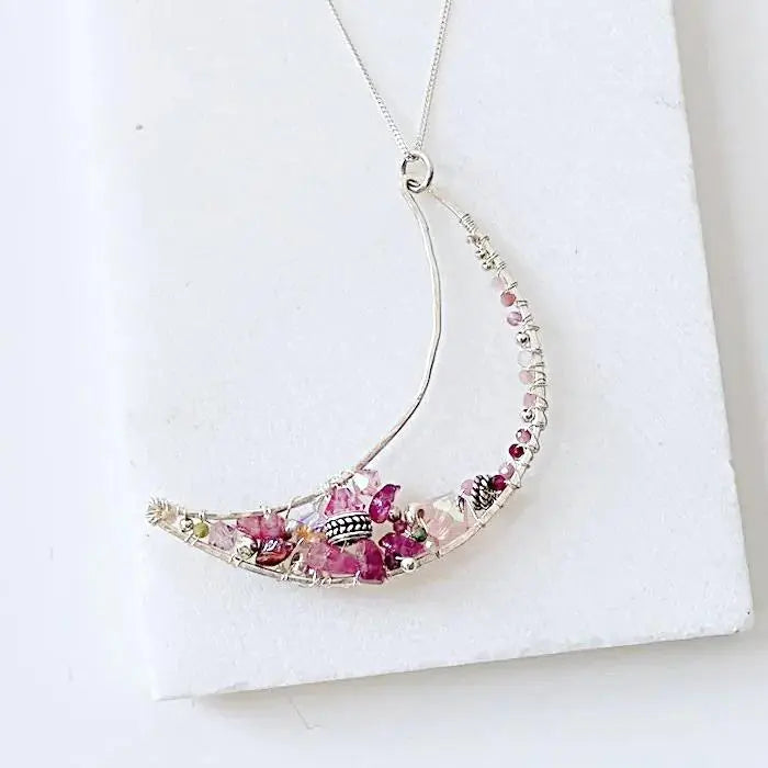 Elegant Moon Necklace Sterling Silver with handcrafted pink tourmaline and freshwater pearls, crescent design on fine 18” chain.