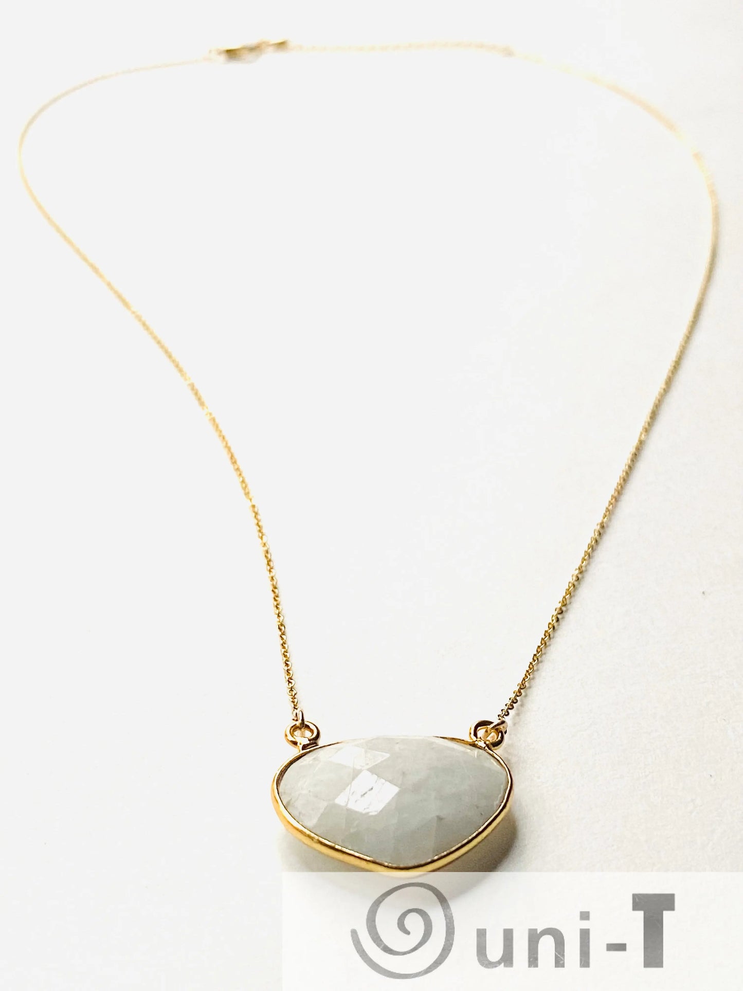 Moonstone necklace with adjustable gold filled chain and faceted gemstone pendant. A timeless piece for jewelry collections.