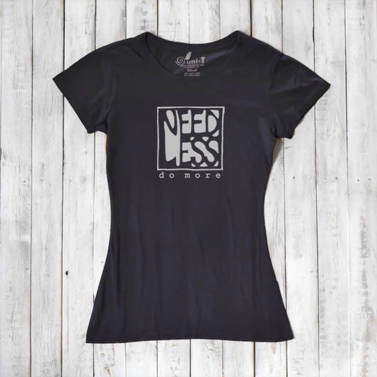 Black women's bamboo and organic cotton t-shirt with 'Need Less Do More' graphic. Sustainable inspirational gift for minimalist lifestyle.